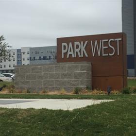 Park West uses a monument sign to help visitors locate the complex